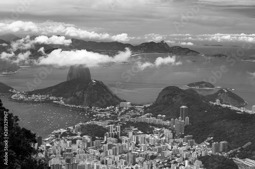 Fototapeta Naklejka Na Ścianę i Meble -  Black and white Sugarloaf Mountain (Pão de Açúcar) rising 396 m above the harbor at the mouth of Guanabara Bay on a peninsula and its cableway with panoramic views of the city, Rio de Janeiro, Brazil.