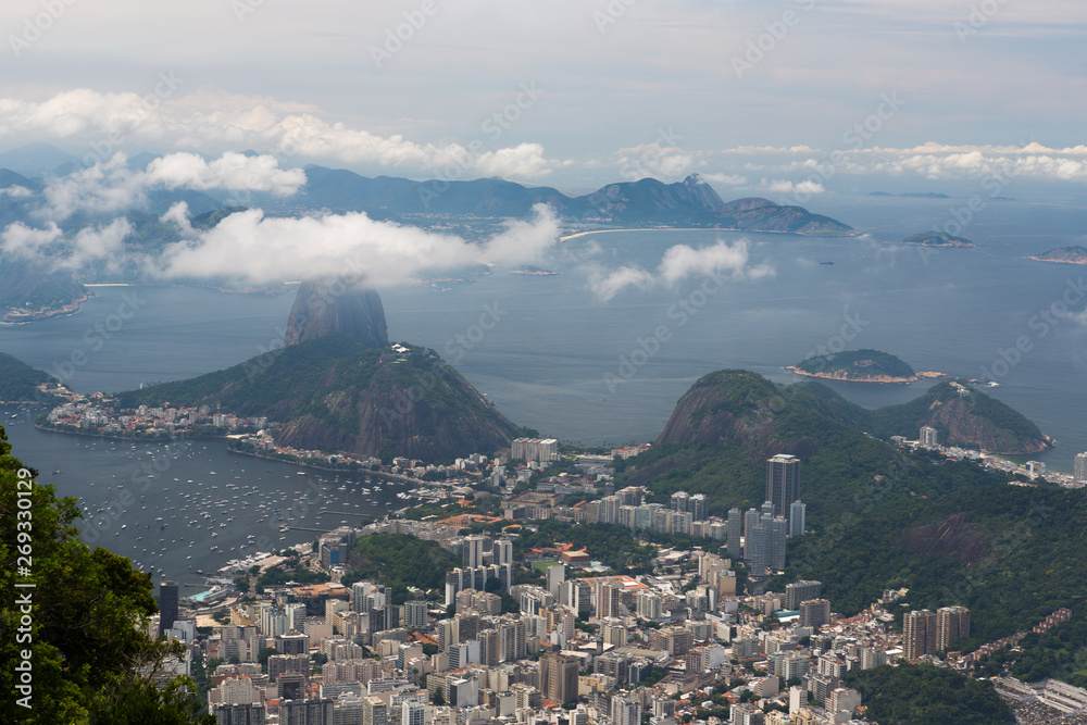 Sugarloaf Mountain (Pão de Açúcar) rising 396 m above the harbor at the mouth of Guanabara Bay on a peninsula and its cableway with panoramic views of the city, Rio de Janeiro, Brazil.
