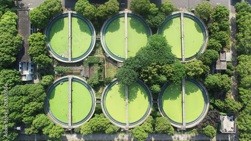 Fotografie A sewage treatment plant covered with green vegetation in the central city of Sh
