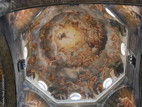 Parma Cathedral. Interior of Parma Cathedral has a Latin Cross plant and an underlying crypt. Naves, chapels and apse houses scuplture of Antelami and frescos of Correggio. The crypt houses the monume photo