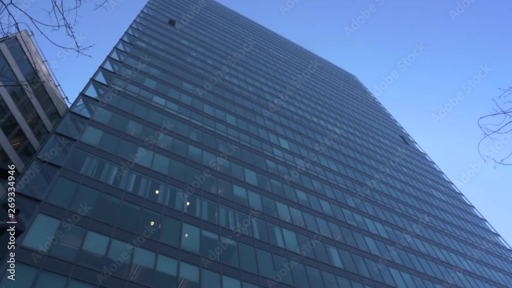 Looking up from the ground toward the top of the Kista Science Tower. Sharp angles and walls of glass in the design of this modern skyscraper towering above other buildings in the area. Looking up from the ground toward the top of the Kista Science Tower. Sharp angles and walls of glass in the design of this modern skyscraper towering above other buildings in the area.