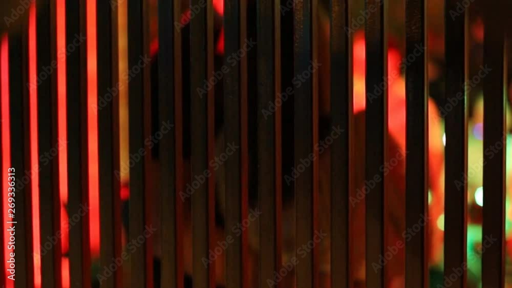 girl and boyfriend dancing in a nightclub behind bars. Dancing couple at a party girl and boyfriend dancing in a nightclub behind bars. Dancing couple at a party