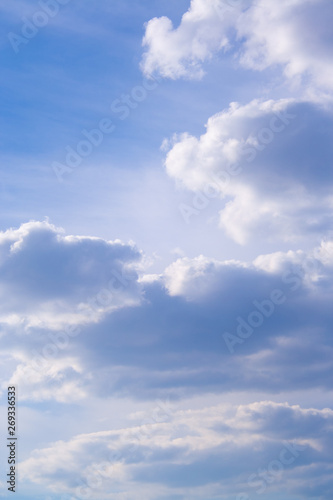 White clouds high in the sky at windy winter day background