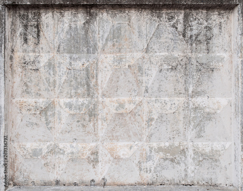 Fragment of a concrete fence. Peeling concrete fence. Peeling concrete wall. Background.