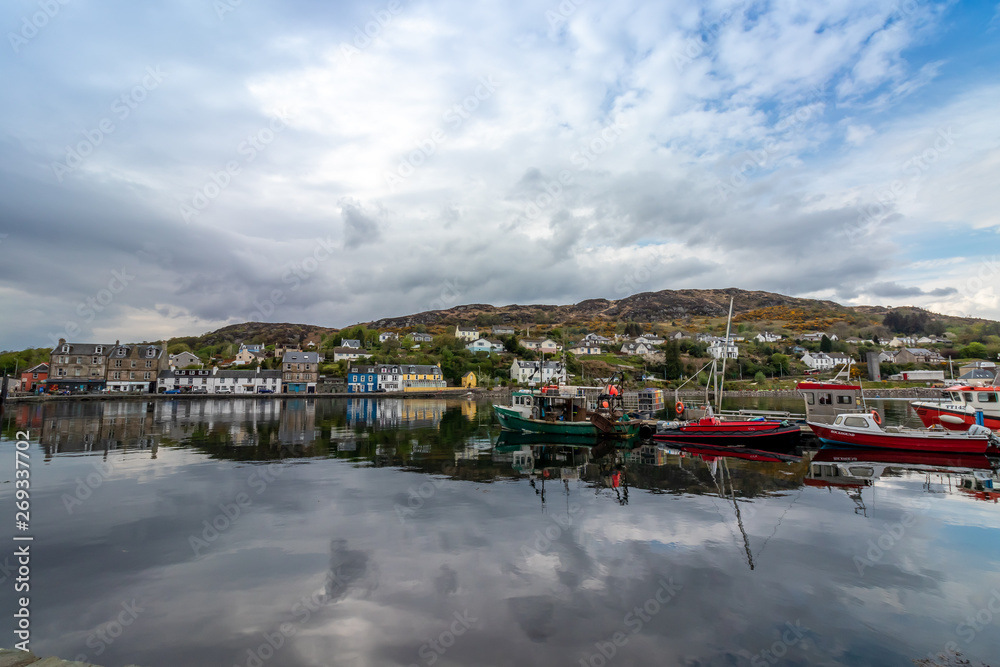 View of Tarbert Harbour and Reflection of Buildings in Water Tarbert, Scotland, UK