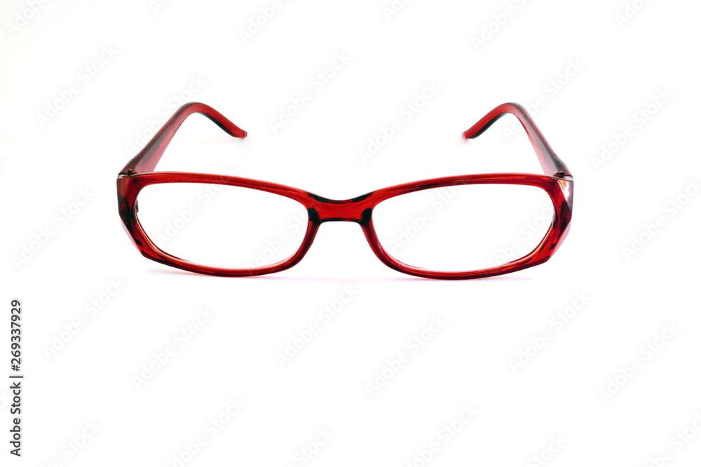 Close to the red glasses on the white background. Close to the red glasses on the white background.
