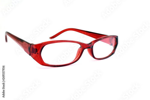 Close to the red glasses on the white background.