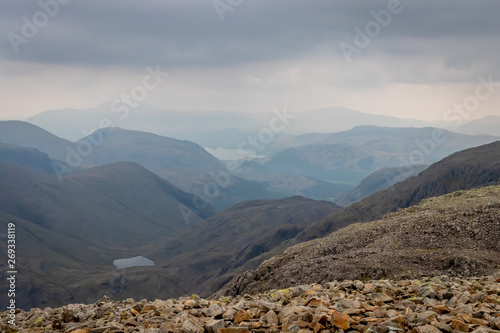 Scafell Pike Summit with Dramatic Grey Clouds, Lake District, England, UK photo