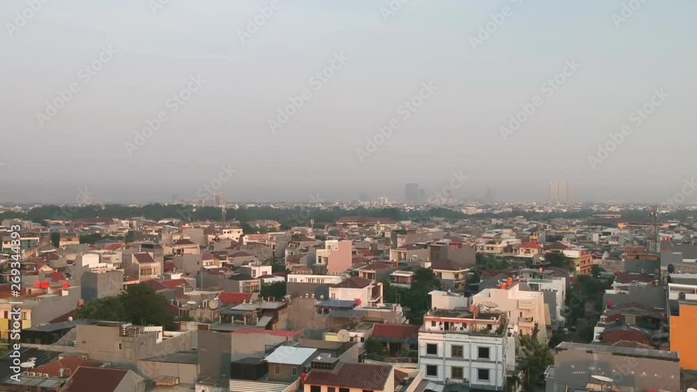 Drone aerial establish shot of Muara Karang townscape. Camera pushing in Drone aerial establish shot of Muara Karang townscape. Camera pushing in