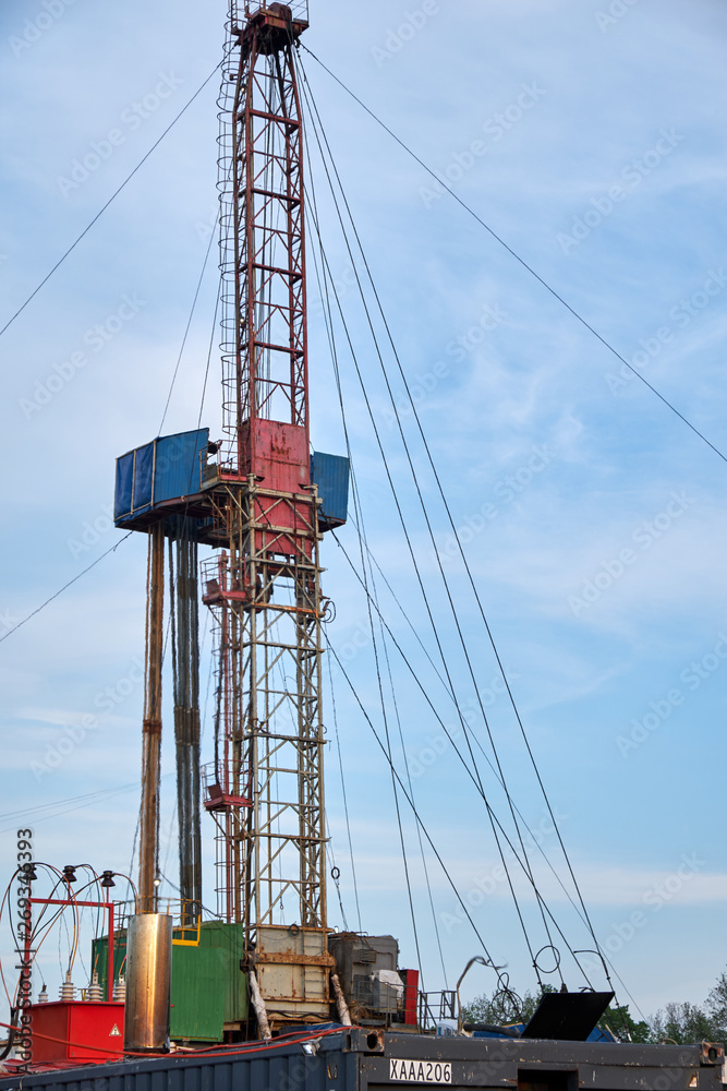 part of the rig in action with pipes in the evening part of the rig in action with pipes in the evening