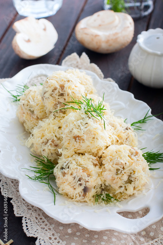 Salad with mushrooms in the form of balls in cheese, rafaello, selective focus