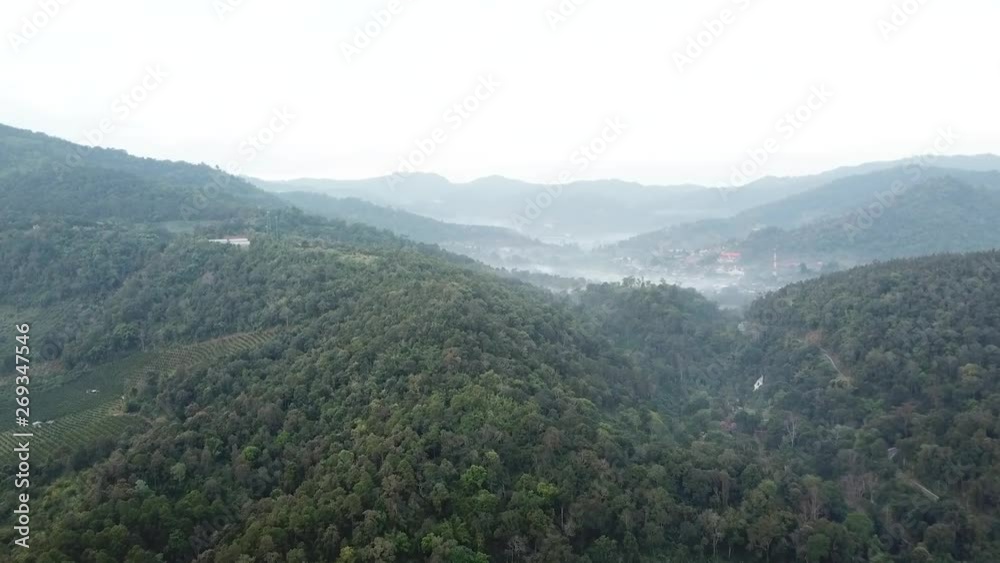 Aerial of flying over a beautiful green forest in a rural landscape, Chiang Mai, Thailand. Aerial of flying over a beautiful green forest in a rural landscape, Chiang Mai, Thailand.