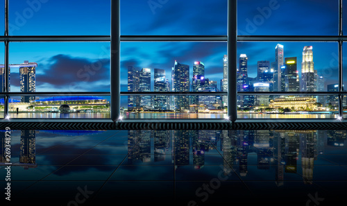 Photography Modern empty and clean office interior with glass windows , Singapore city skyline background , early morning scene