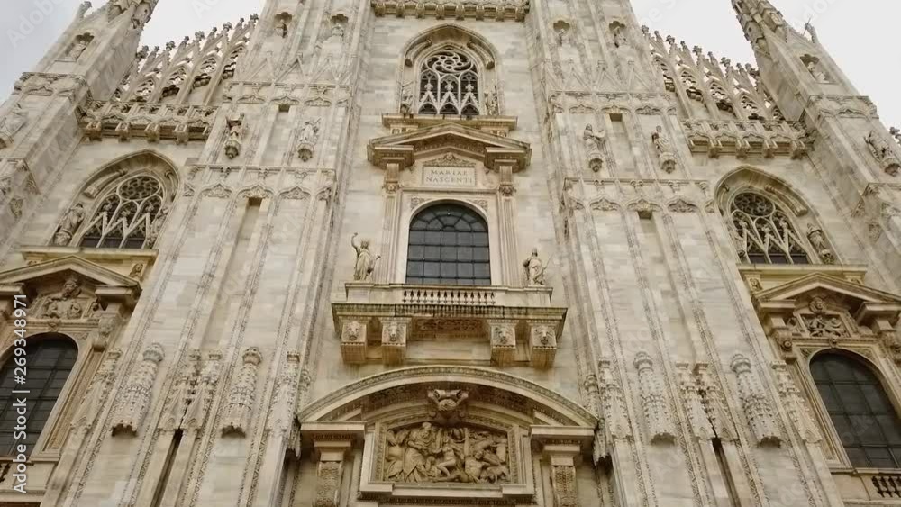 Dolly shot walking toward the Duomo church in Milan in 4k slowmo Dolly shot walking toward the Duomo church in Milan in 4k slowmo