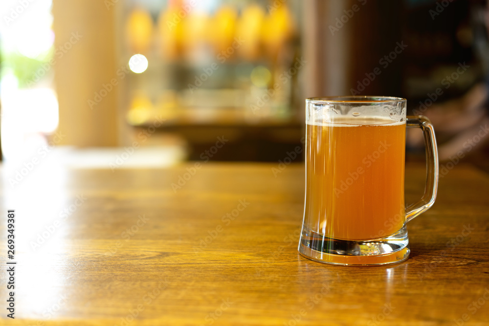 close up front view glass of craft beer on table in the restaurant for modern city lifestyle close up front view glass of craft beer on table in the restaurant for modern city lifestyle