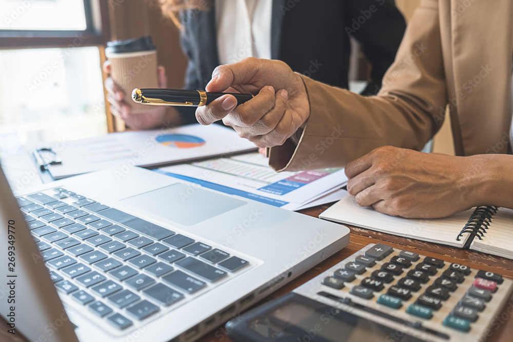Business team brainstorming and discussing with financial data and report graph. Teamwork meeting working concept. Business team brainstorming and discussing with financial data and report graph. Teamwork meeting working concept.