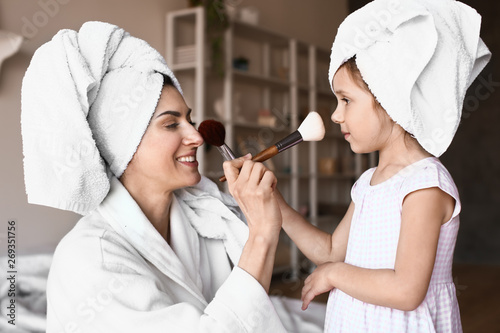 Mother with cute daughter d...