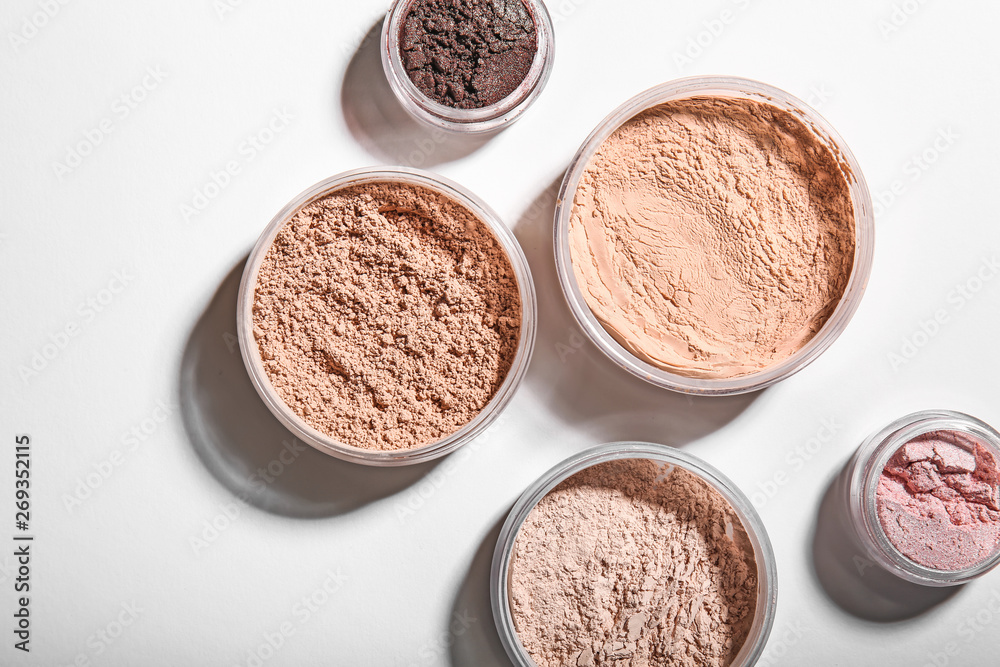 Different facial powder on light background Different facial powder on light background