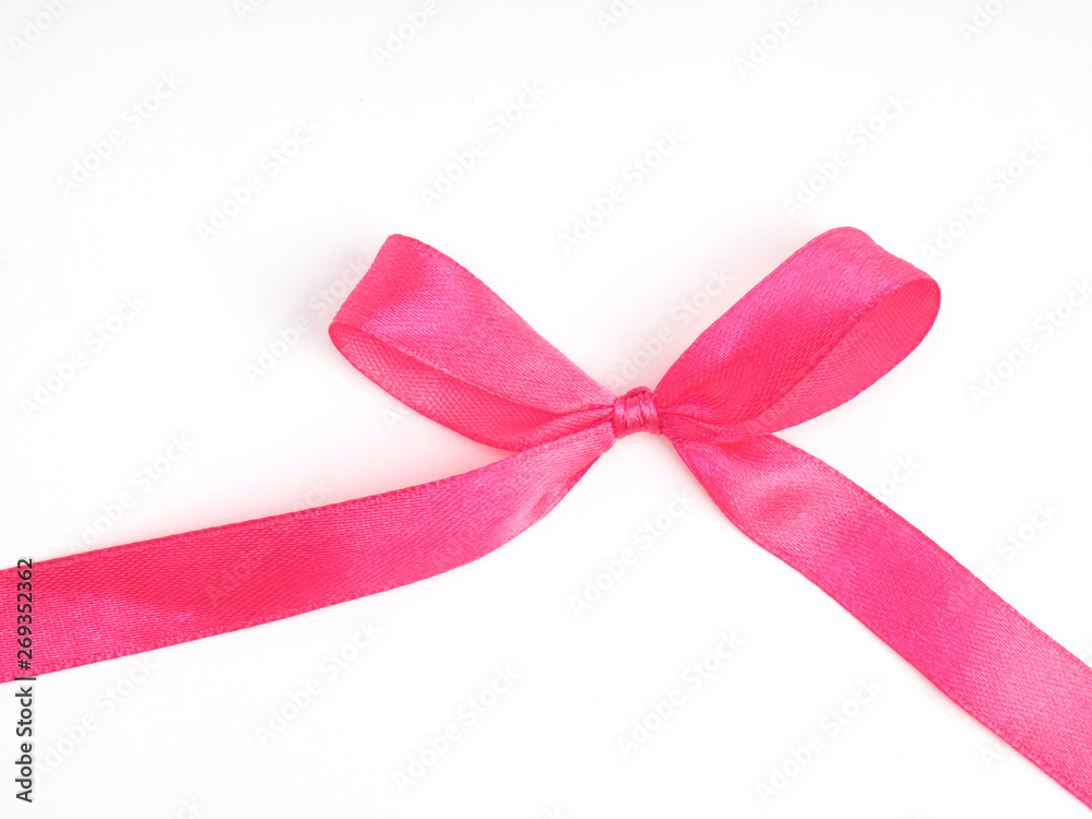 Pink satin ribbon bow on white background Pink satin ribbon bow on white background