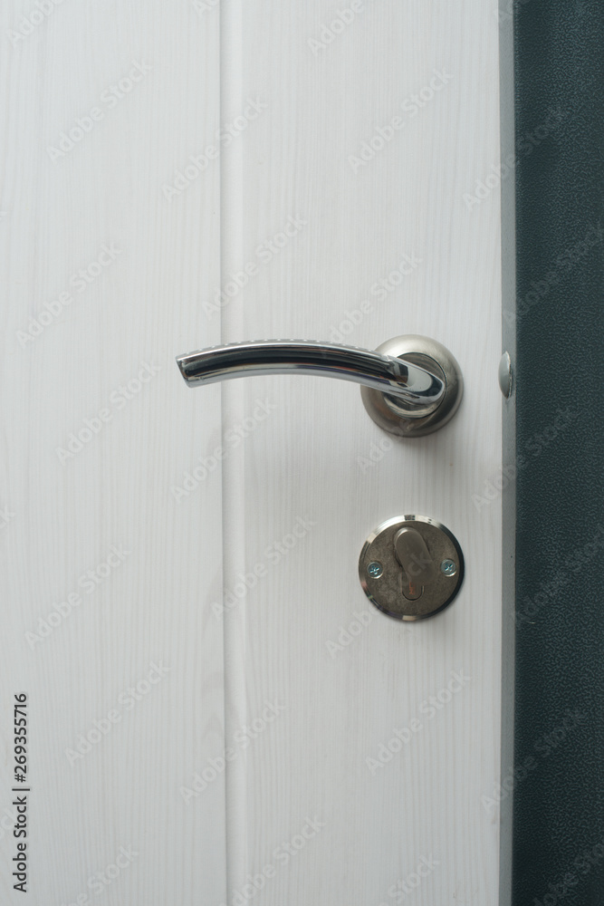 door lock closeup. steel doors. key in the door lock door lock closeup. steel doors. key in the door lock