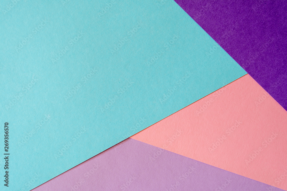 Multicolored paper background in soft blue, violet, lilac and coral colors. Multicolored paper background in soft blue, violet, lilac and coral colors.