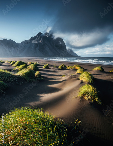 Unique view on the green hills with sand dunes. Location Stokksnes cape, Vestrahorn, Iceland.