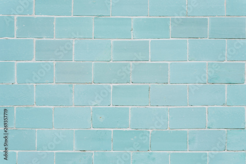 The texture of the brick wall. The wall of blue brick. Close to the wall