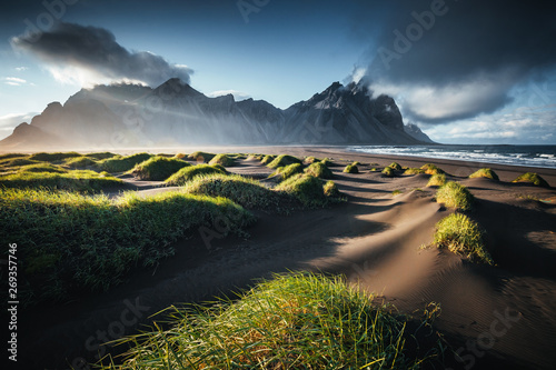 Unique view on the green hills with sand dunes. Location Stokksnes cape, Vestrahorn, Iceland. photo