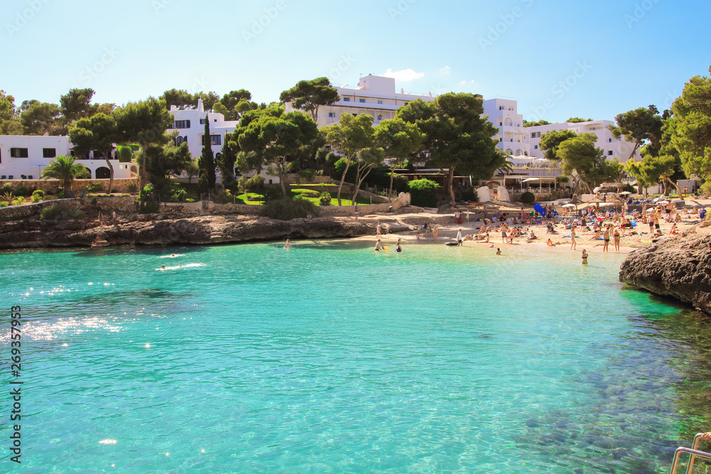 Beautiful Cala d'Or Beach in sunny summer day with turquoise water. Beach Cala Gran in Cala d'Or, Mallorca, Spain.