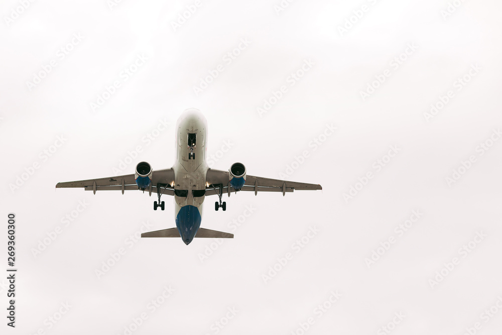 White passenger airplane flies against the sky White passenger airplane flies against the sky