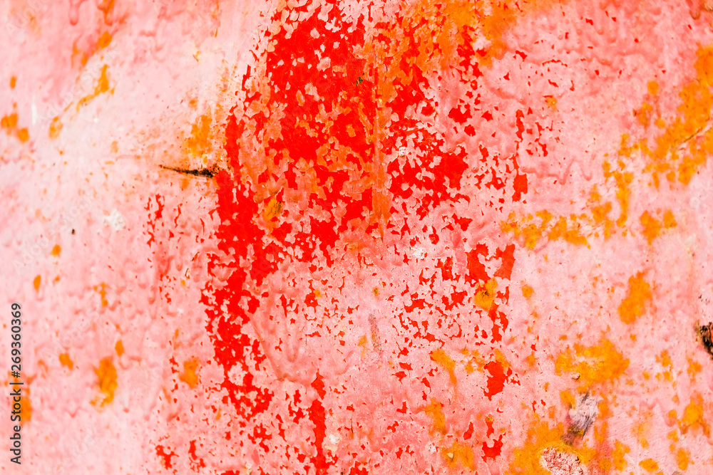Fototapeta premium Old corroded metal wall background with flaky red paint .Rusty flaky cracked metal surface.Abstract the surface texture of the old metal.
