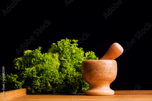 Mortar with pestle isolated on black background