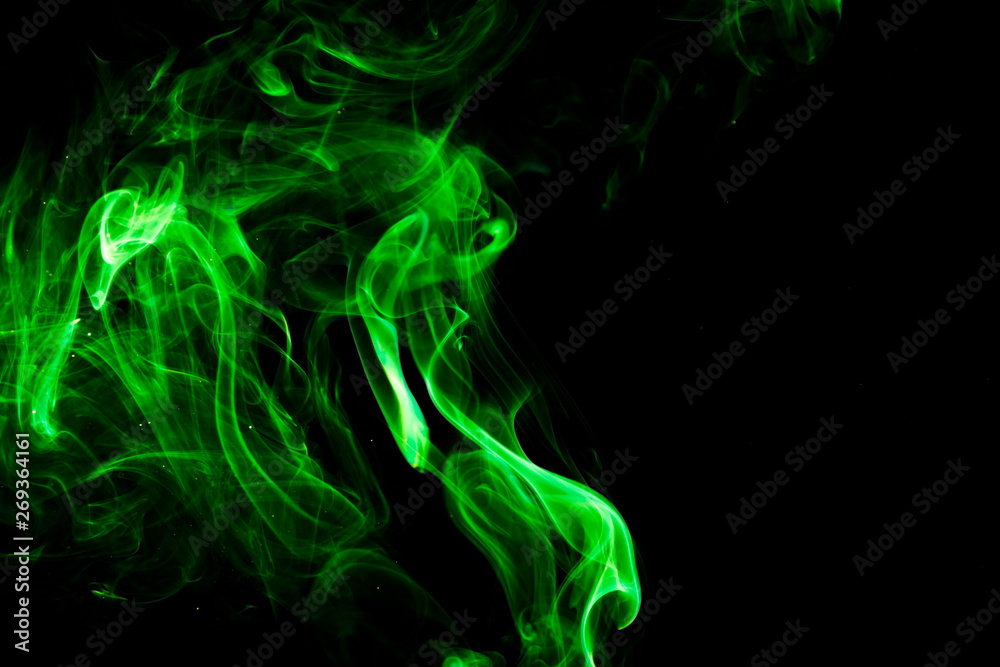 Fototapeta premium Green smoke on black background