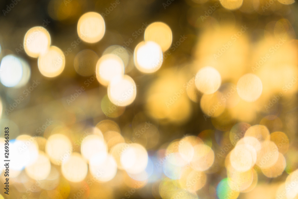 Blurred abstract background of Christmas lights.Brightly glowing yellow-orange balls and lines.Abstract color patterns
