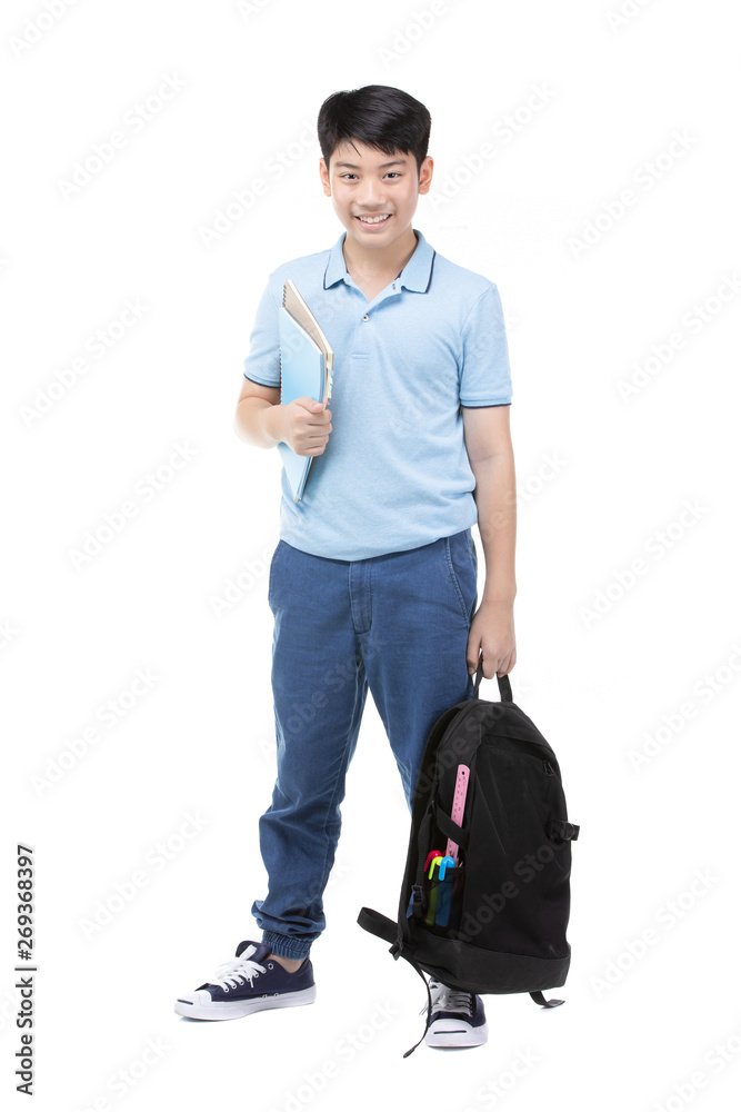 Smiling little student boy in blue polo t-shirt in with books and bag. Smiling little student boy in blue polo t-shirt in with books and bag.
