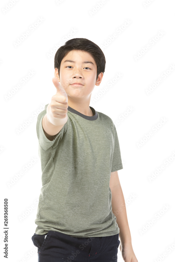 Asian excited boy in green-shirt giving thumbs-up. Asian excited boy in green-shirt giving thumbs-up.