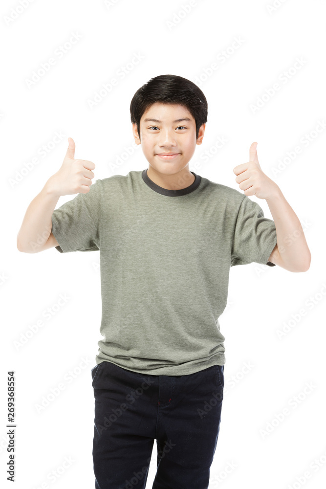 Asian excited boy in green-shirt giving thumbs-up. Asian excited boy in green-shirt giving thumbs-up.