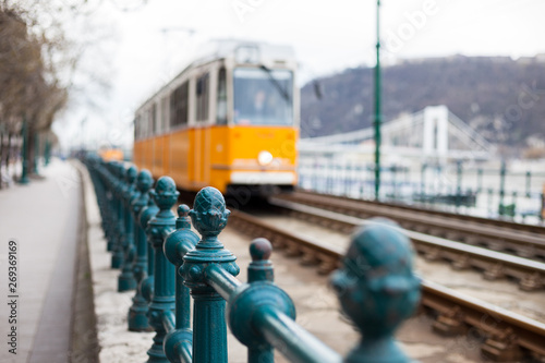 Retro yellow tram in Budapest street in Hungary. Abstract blurred background