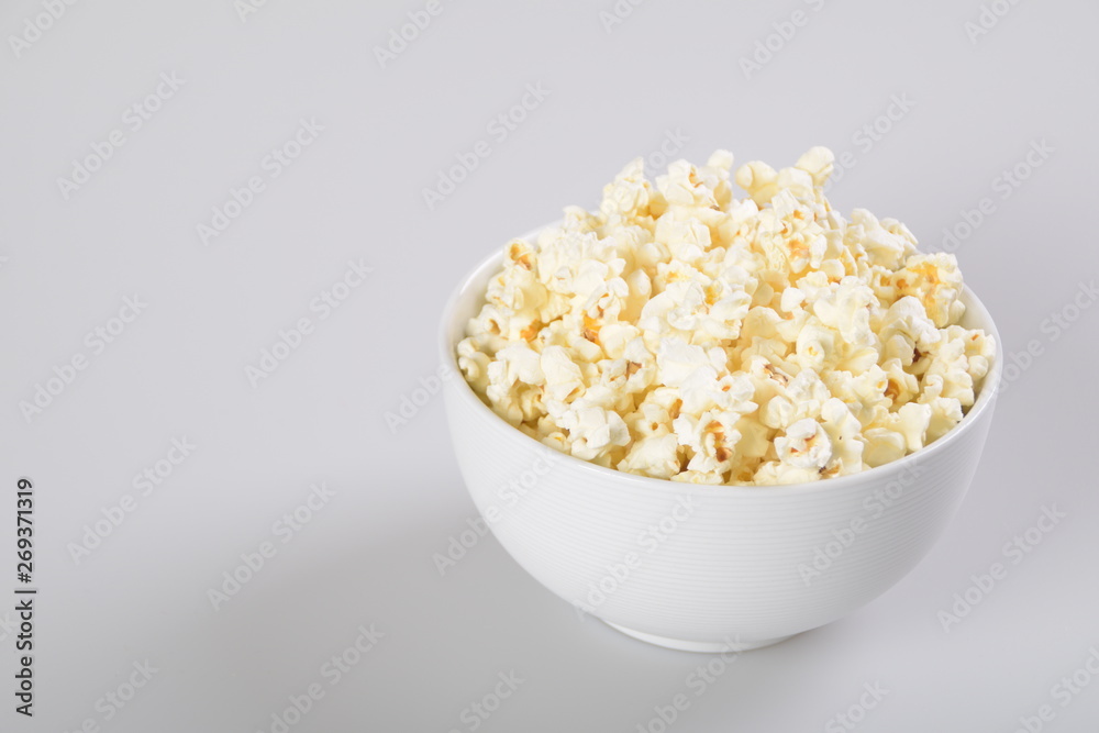 Bowl with popcorn. Isolated on white background. Bowl with popcorn. Isolated on white background.
