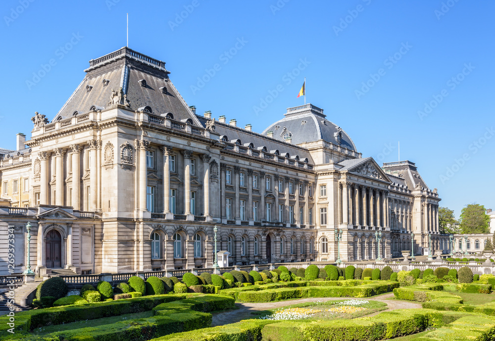 Three-quarter view of the colonnade and formal garden of the Royal Palace of Brussels, the official palace of the King and Queen of the Belgians in the historic center of Brussels, Belgium.
