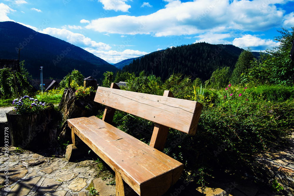 wooden bench with landscape view of mountain and fog wooden bench with landscape view of mountain and fog