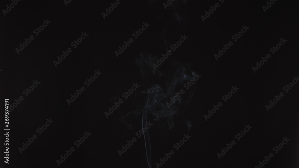 Obraz premium Emergence of a thin stream of smoke or steam vape. Cigarette smoke, beautiful and high-quality background animation