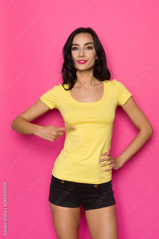 Beautiful Woman Is Pointing At Herself, Smiling And Looking At Camera