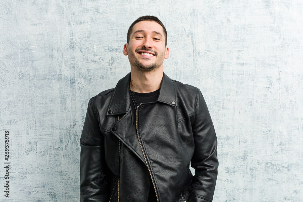 Young rocker man happy, smiling and cheerful. Young rocker man happy, smiling and cheerful.