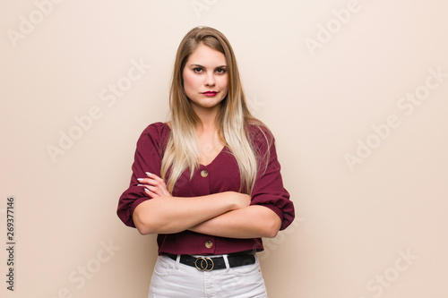 Young russian woman crossing arms relaxed
