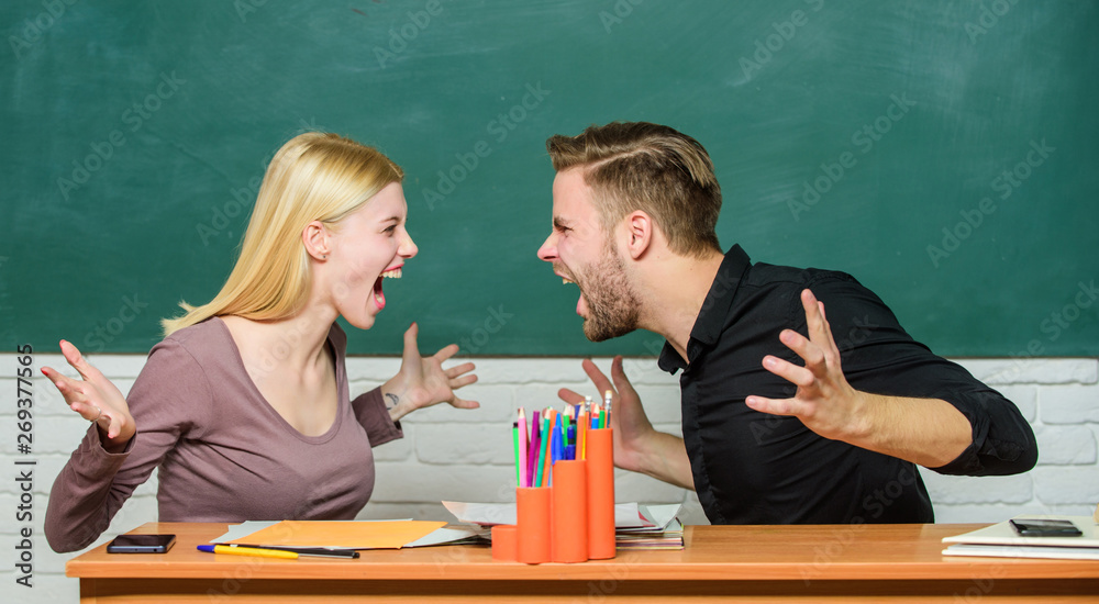 Relations classmates. Students communicate classroom chalkboard background. Violence and bullying. Communication between group mates. Friendship and relations. Compromise solution. College relations