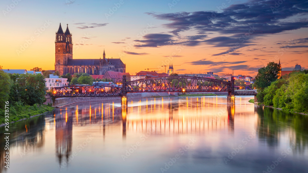 Magdeburg, Germany. Cityscape image of Magdeburg, Germany with reflection of the city in the Elbe river, during sunset.