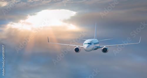 White passenger airplane in the clouds -  Airplane take off from the  airport    - Travel by air transport