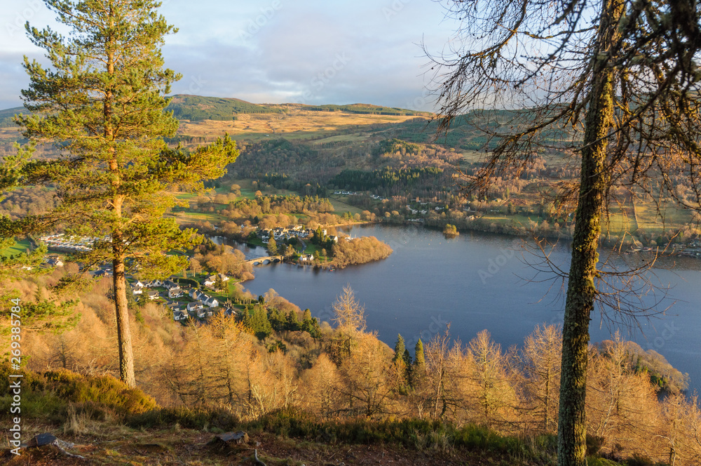 View of the village of Kenmore in Pertshire, Scotland from Drummond Hill in autumn. View of the village of Kenmore in Pertshire, Scotland from Drummond Hill in autumn.