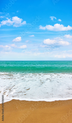 Sandy beach and sea waves